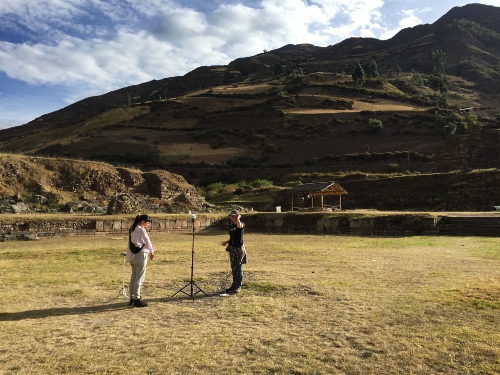 Two researchers set up a microphone in Chavín's Plaza Mayor